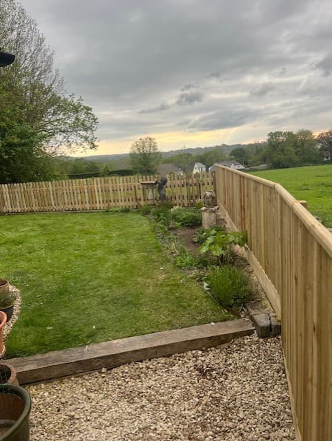 Long feather-edge fence run with countryside views by Inside and Out Maintenance, North Devon