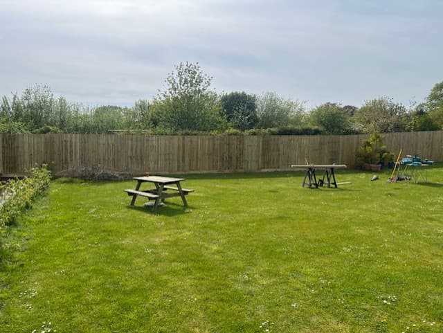 Back garden fence run with picnic seating by Inside and Out Maintenance, North Devon