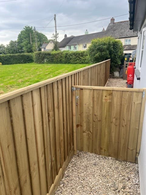 Side passage feather-edge fence panels by Inside and Out Maintenance, North Devon